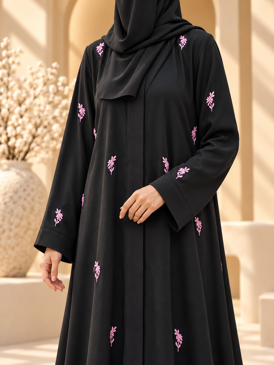 Gulabi Sprig Embroidered Abaya — floral embroidery detail in sunlit courtyard