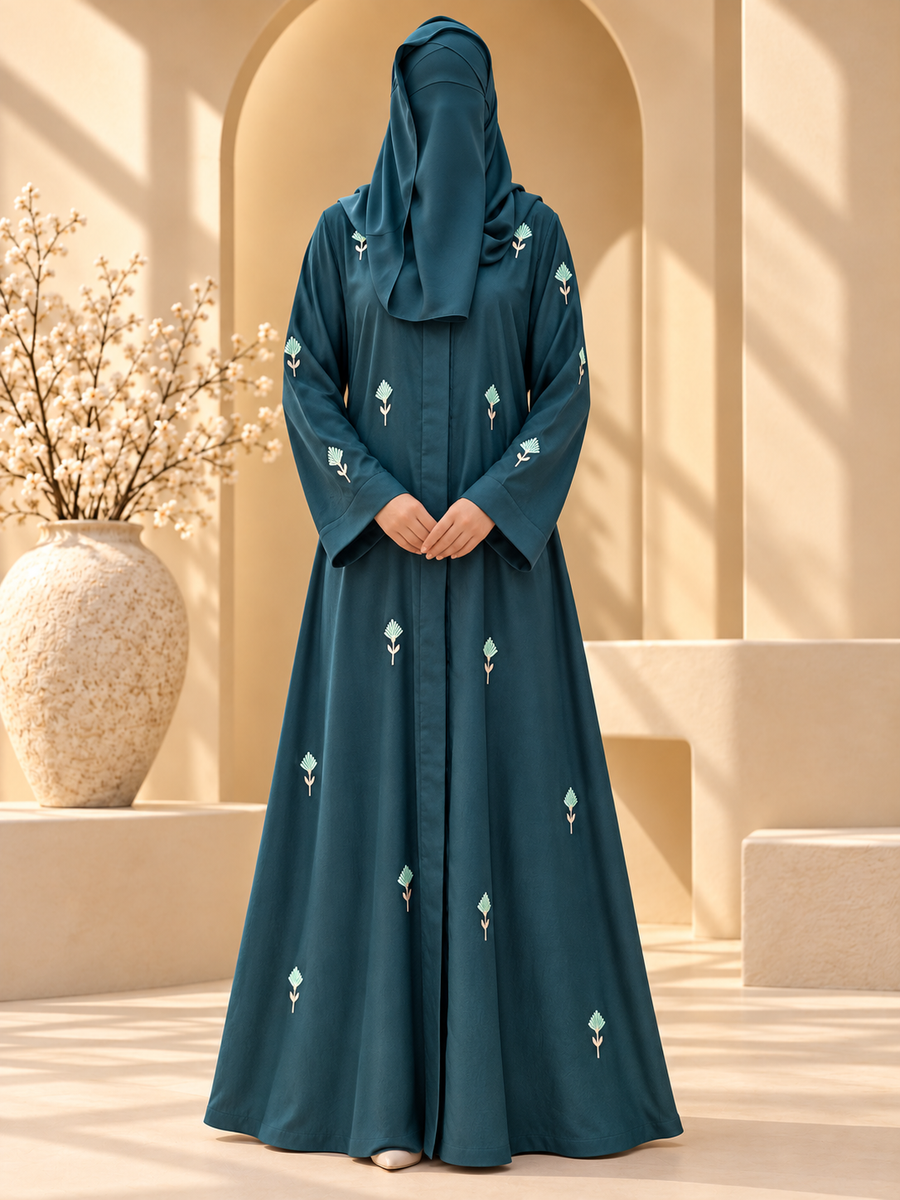 Gul-e-Naz Deep Teal floral sprig embroidered abaya in sunlit courtyard — front view