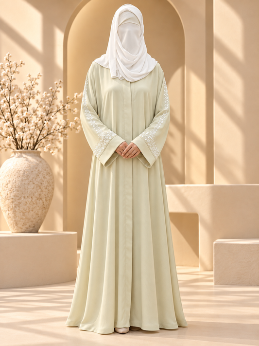 Naqsh Geometric Sleeve Embroidered Abaya — front in sunlit courtyard